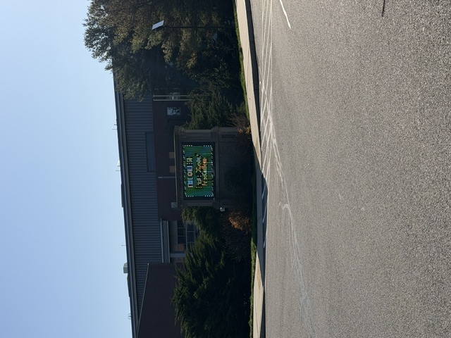 Parking lot C sign marking the path to buildings